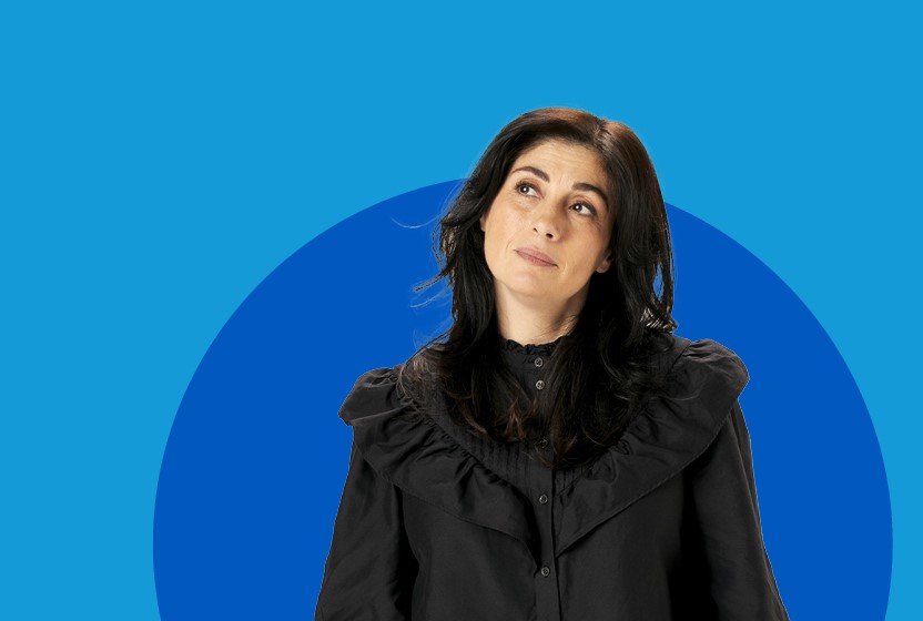woman in front of blue background