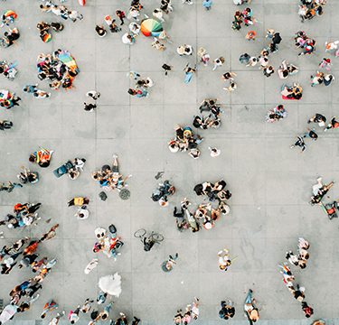 people seen from above crossing street